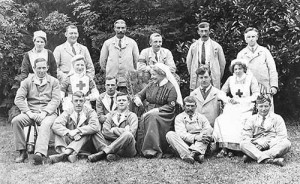 The matron, Doozy Thompson, with a group of patients on the lawn at Mill House